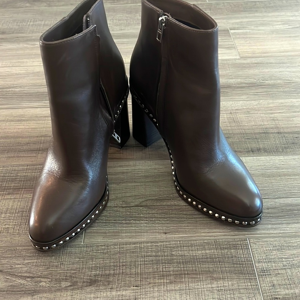 A pair of coach studded ankle boots.